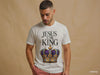 teen wearing J316 Label white Christian streetwear t-shirts. Front view features Jesus is the King graphic with crown.